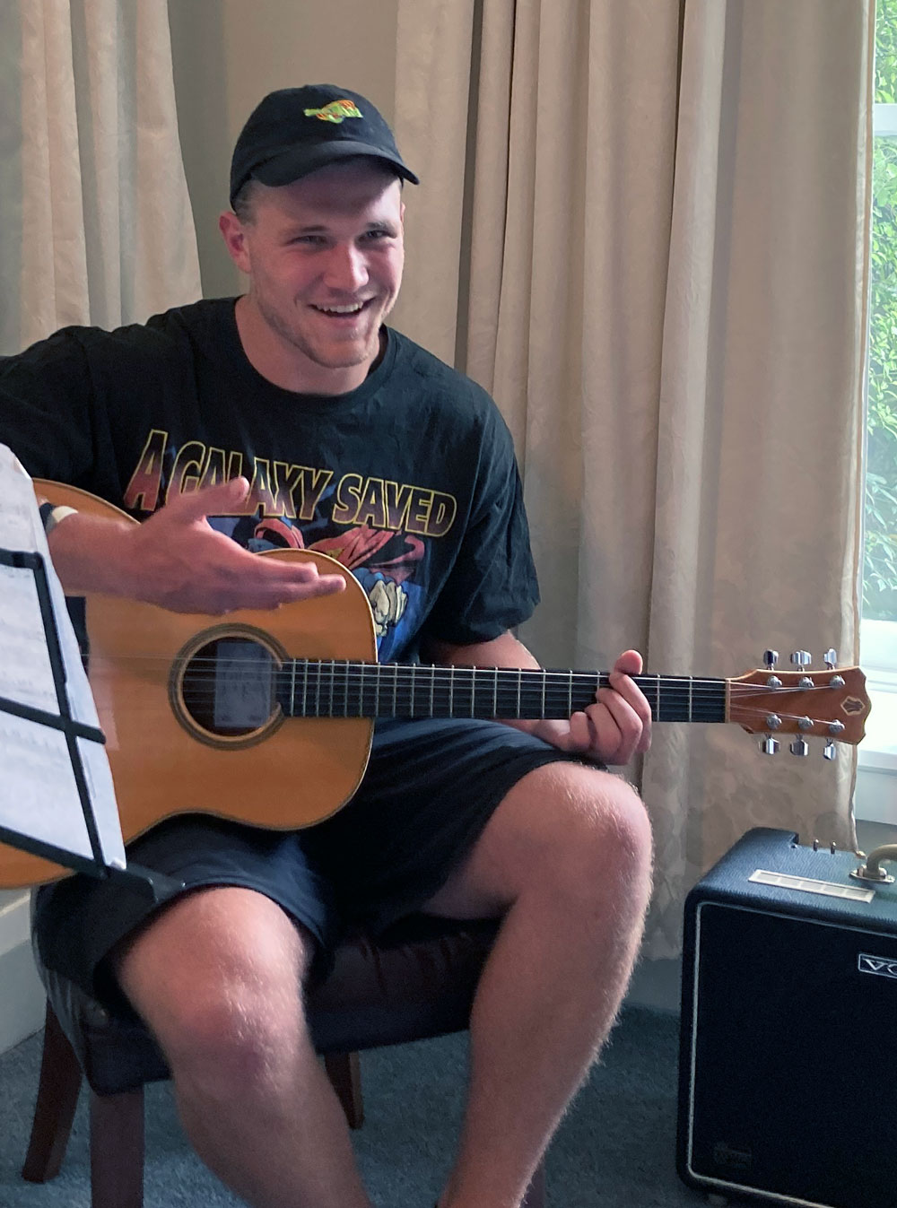 Teenage boy playing guitar